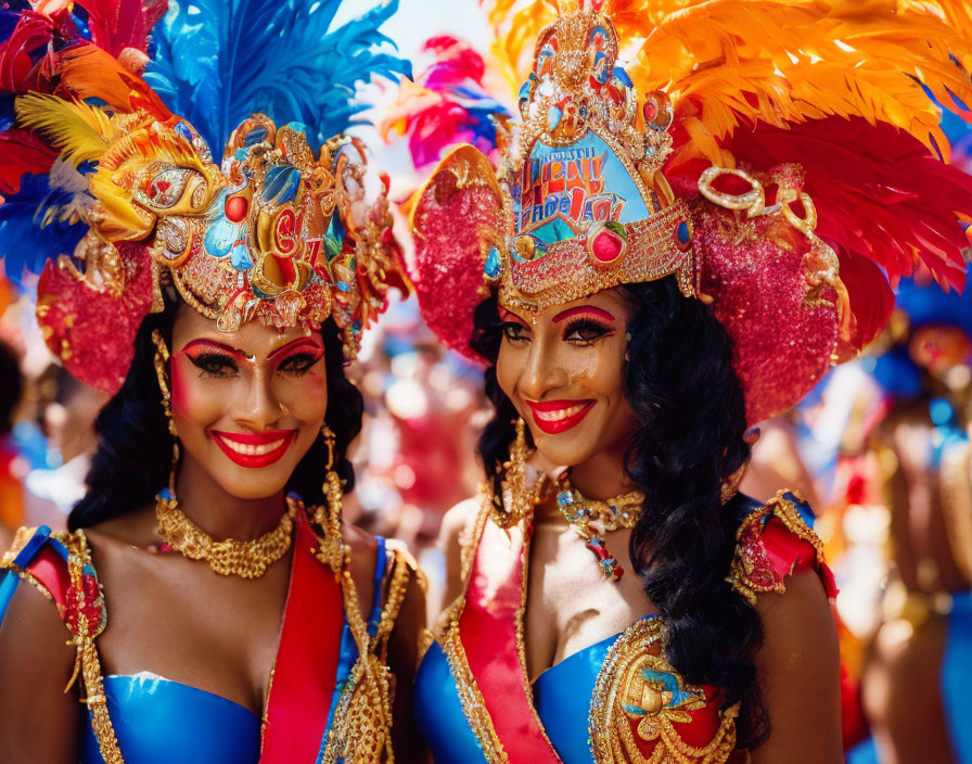 Colorful carnival costumes with feathered headdresses and painted masks at outdoor event