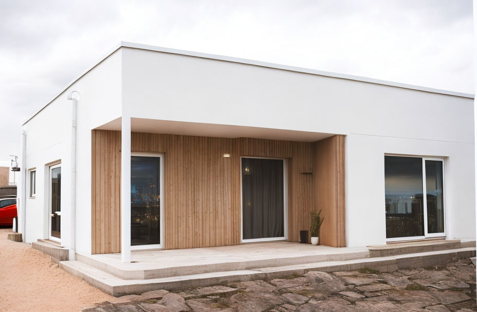 Contemporary Single-Story House with White Walls, Wooden Paneling, Large Windows, and Flat Roof