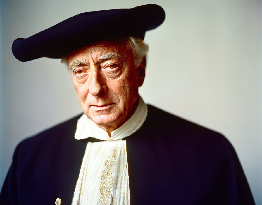 Elderly man in historical attire with black tricorn hat