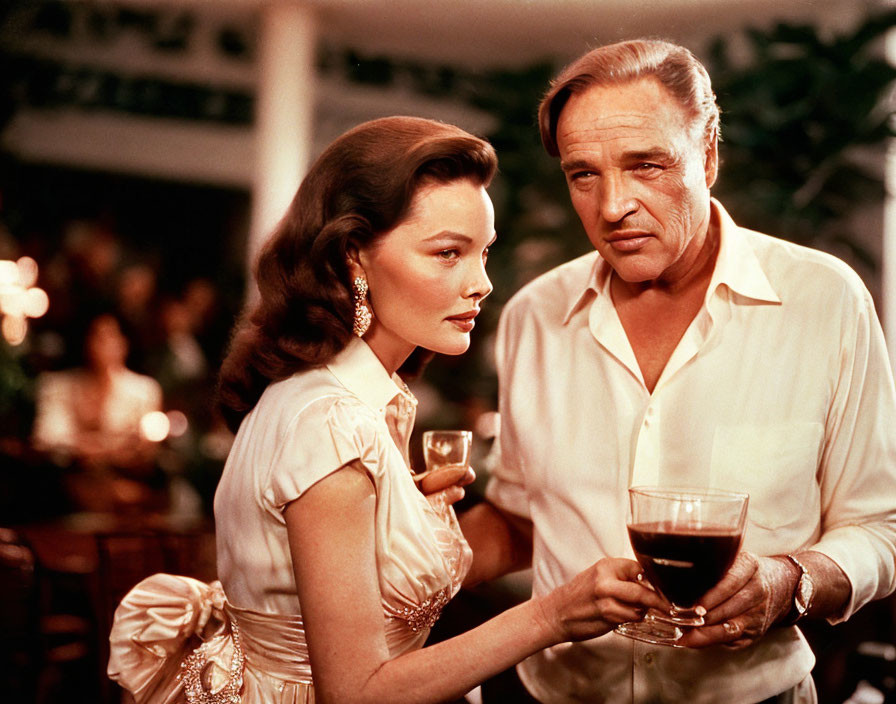 Vintage Photo: Man and Woman Toasting Wine Glasses at Social Gathering