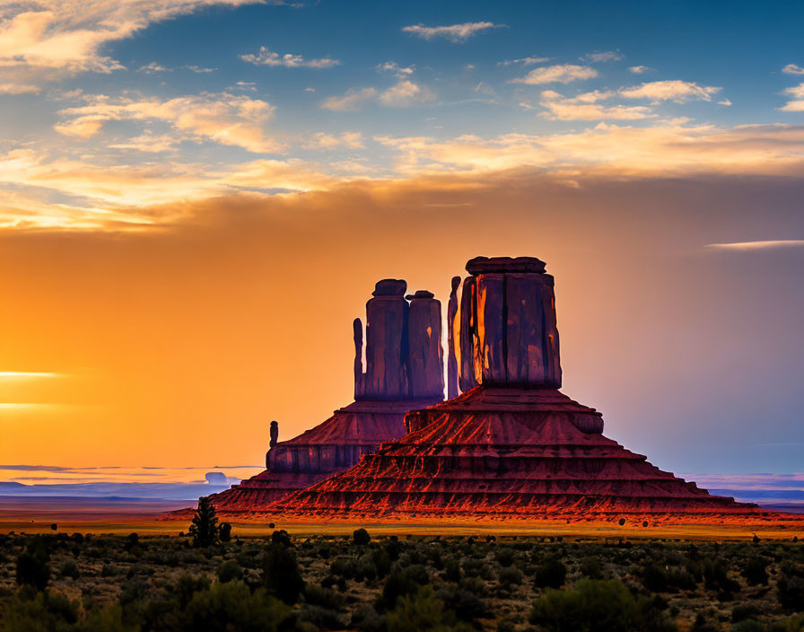 Iconic Monument Valley Buttes Against Vibrant Sunset