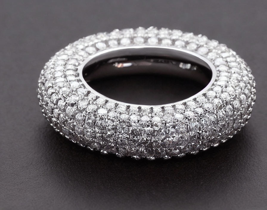 Silver Pavé-Set Diamond Eternity Ring on Black Background