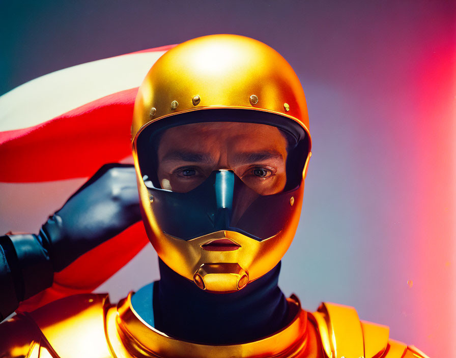 Futuristic person in gold armor with intense gaze on red and blue gradient background