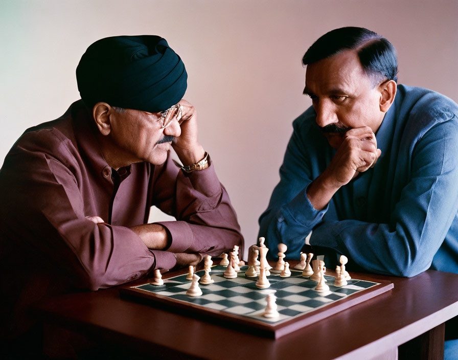 Men in Turban and Chess Player in Concentration