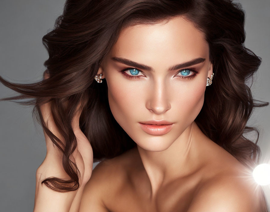 Portrait of Woman with Striking Blue Eyes and Wavy Brunette Hair