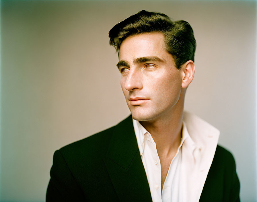 Man in Black Jacket with Slicked-Back Hair Portrait