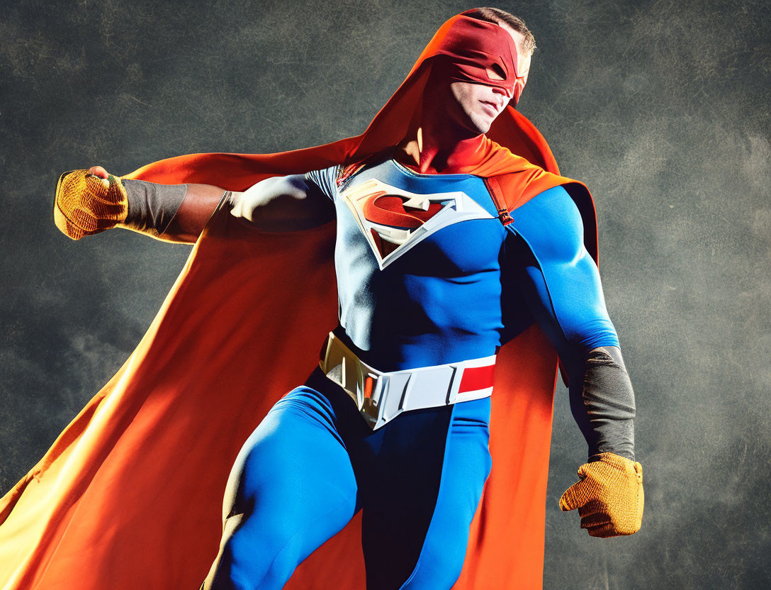 Superhero in red cape and emblem poses confidently