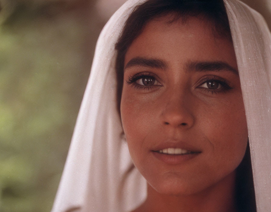 Portrait of a young woman with white scarf and warm skin tone