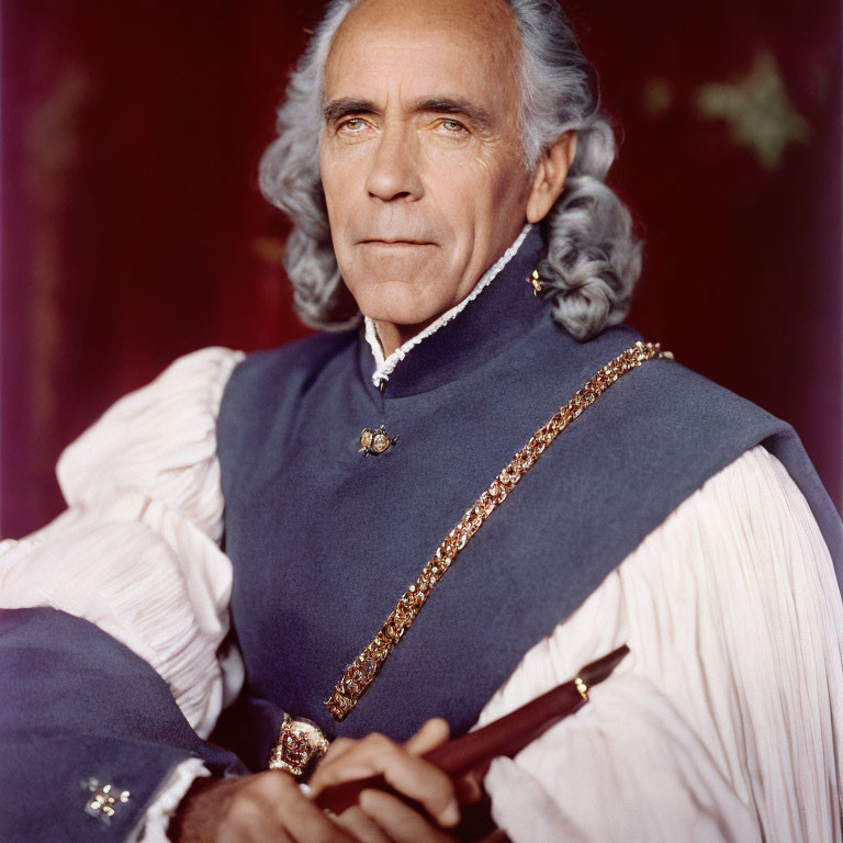 Elderly man in blue historical military uniform with feather quill