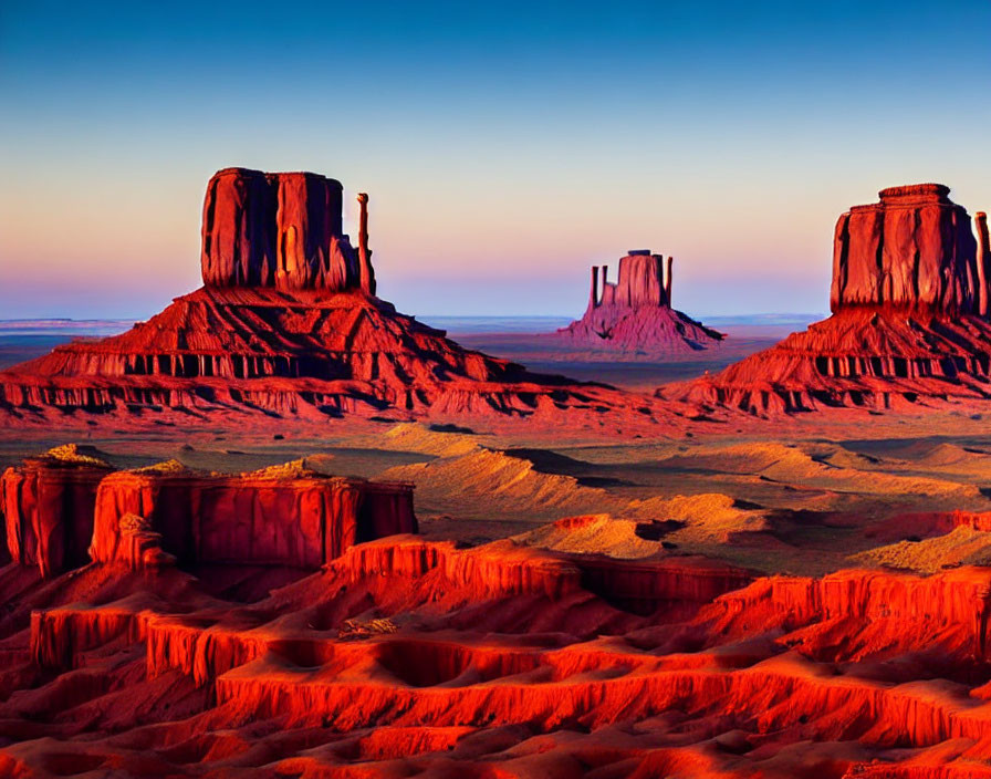 Mesmerizing red-orange mesas and buttes in Monument Valley at sunset