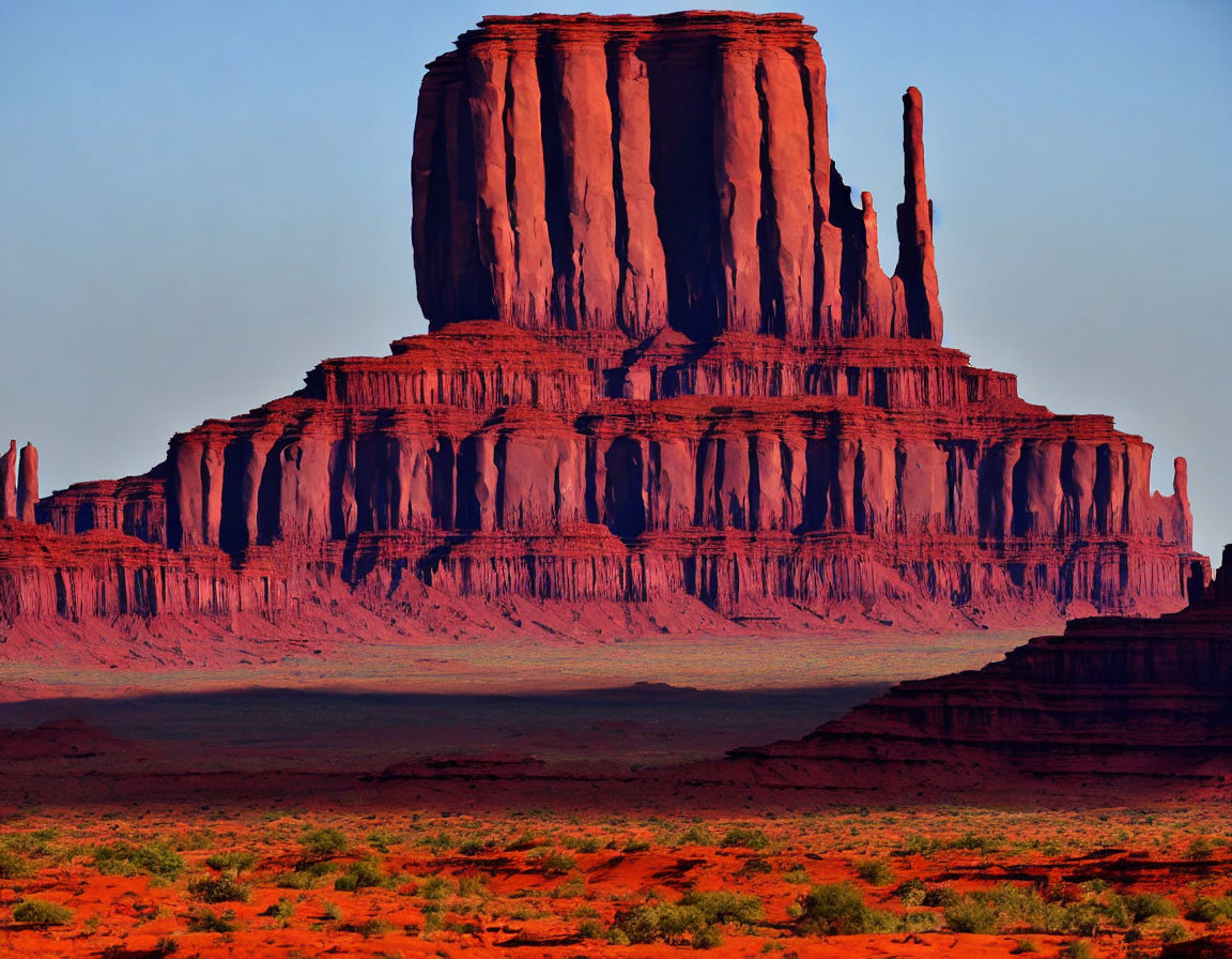 Iconic Monument Valley Buttes at Sunset with Warm Hues