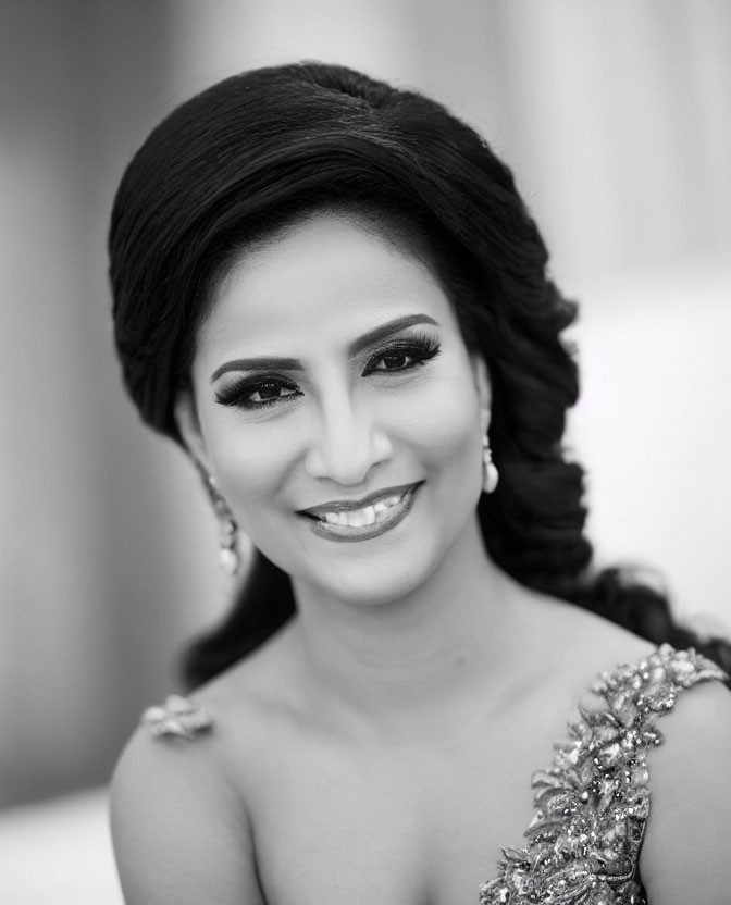 Monochrome portrait of woman with updo hairstyle and embellished outfit