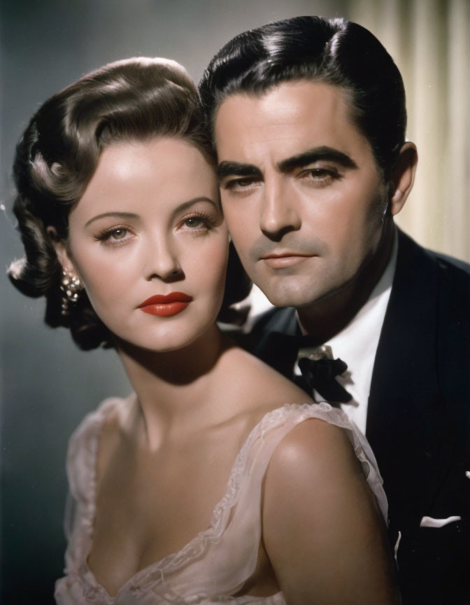 Vintage portrait of man and woman in elegant attire and hairstyles