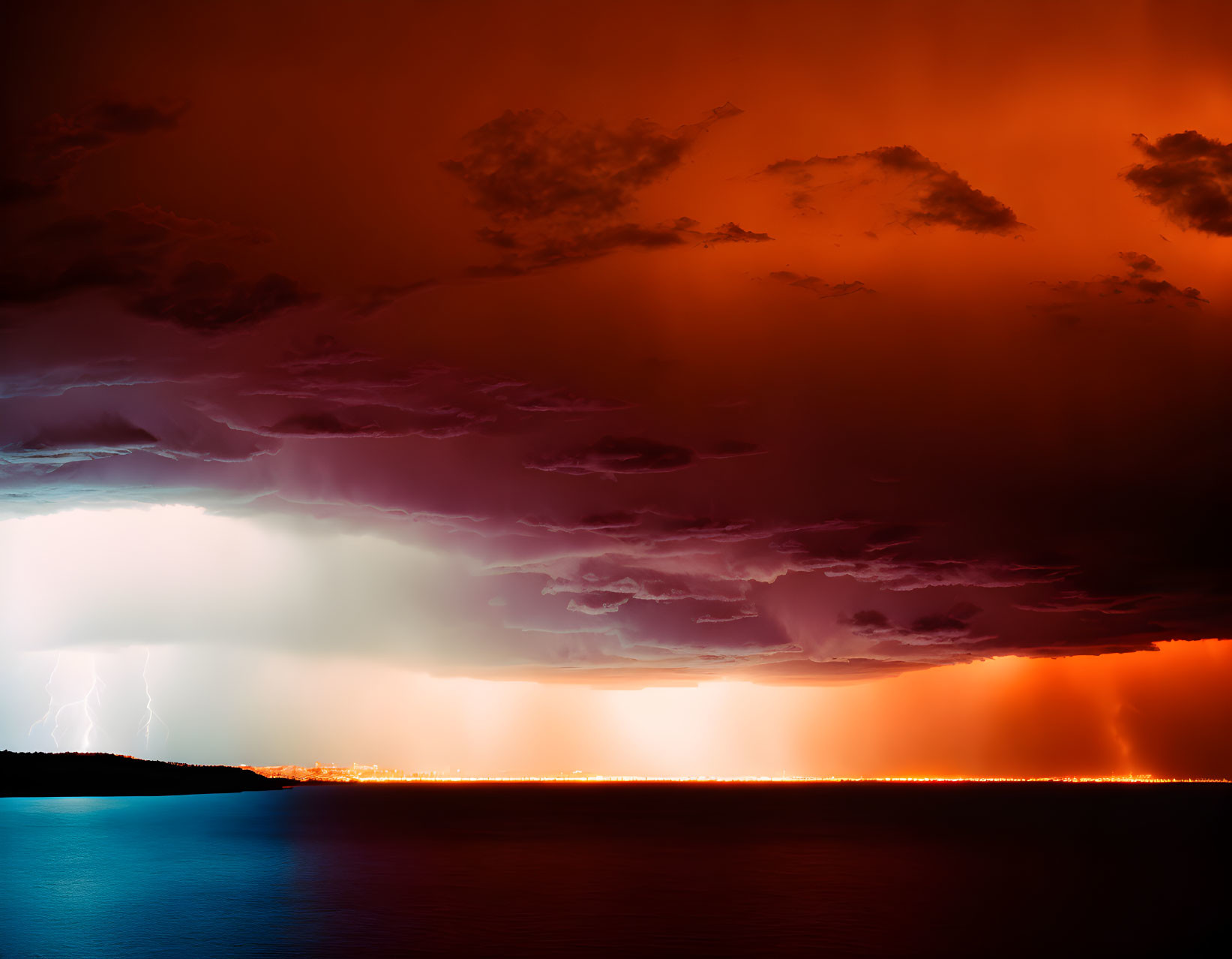 Dramatic thunderstorm with lightning strikes over water