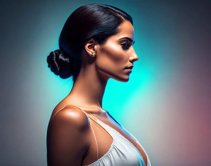 Woman with Sleek Hair and Subtle Makeup on Blue-Tinted Background