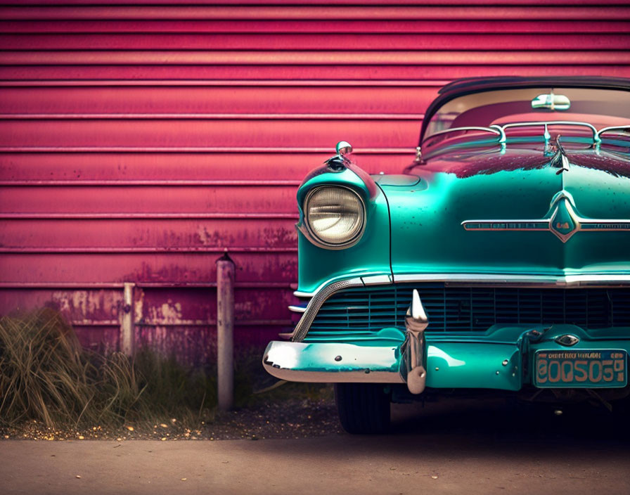 Vintage Turquoise Car Parked in Front of Textured Red Wall