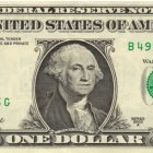 Redesigned US dollar bill featuring young African American man.