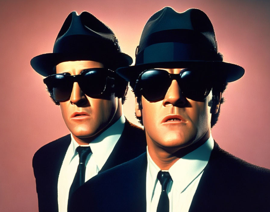 Men in Suits and Fedoras with Sunglasses on Pink Background