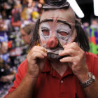 Red suit clown with futuristic headset in server room