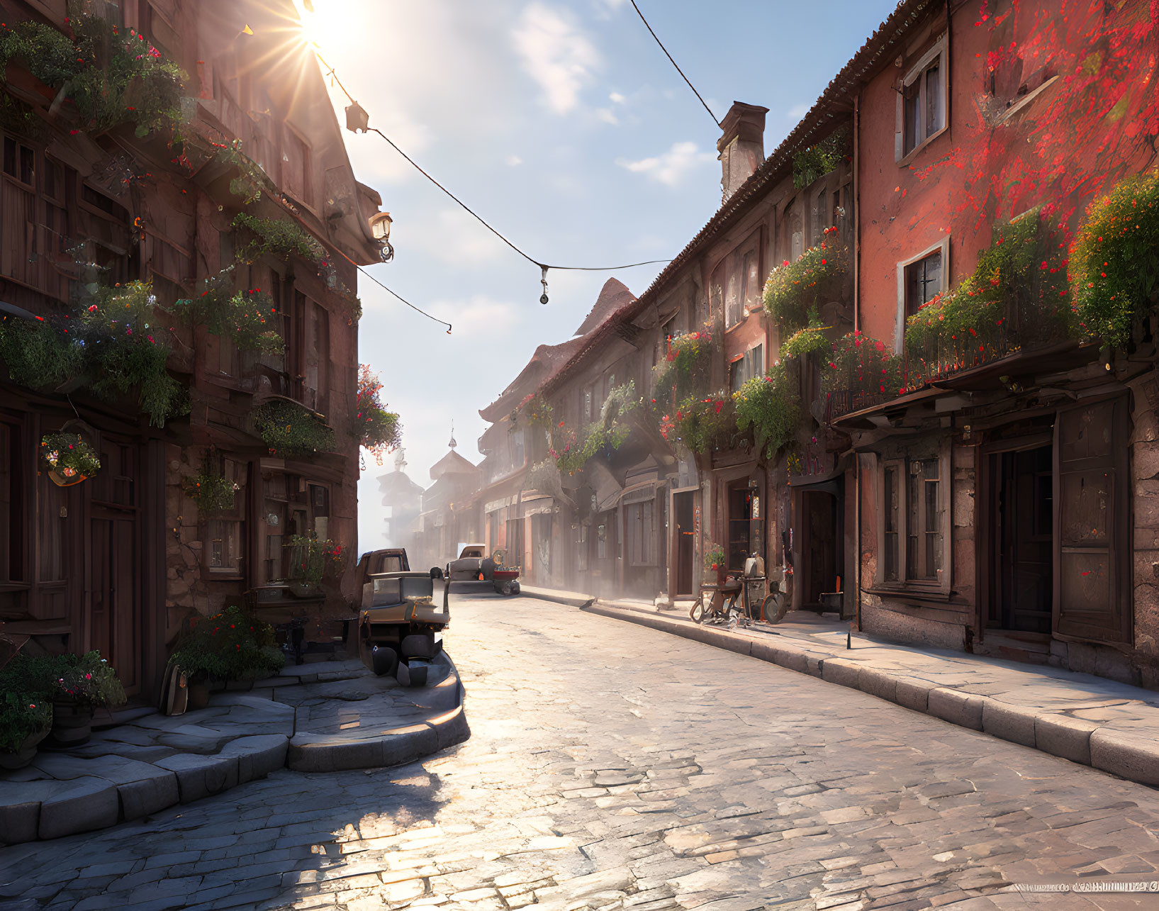 Sunlit cobblestone street with old buildings and flowering plants