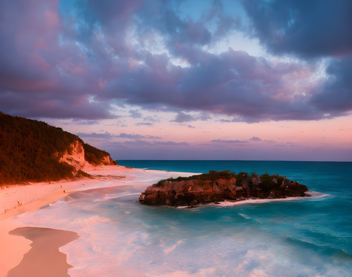 Panoramic Beach Sunset with Foamy Waves and Rocky Outcrop