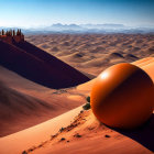 Surreal landscape featuring large orange ball on sand dunes and mountain backdrop