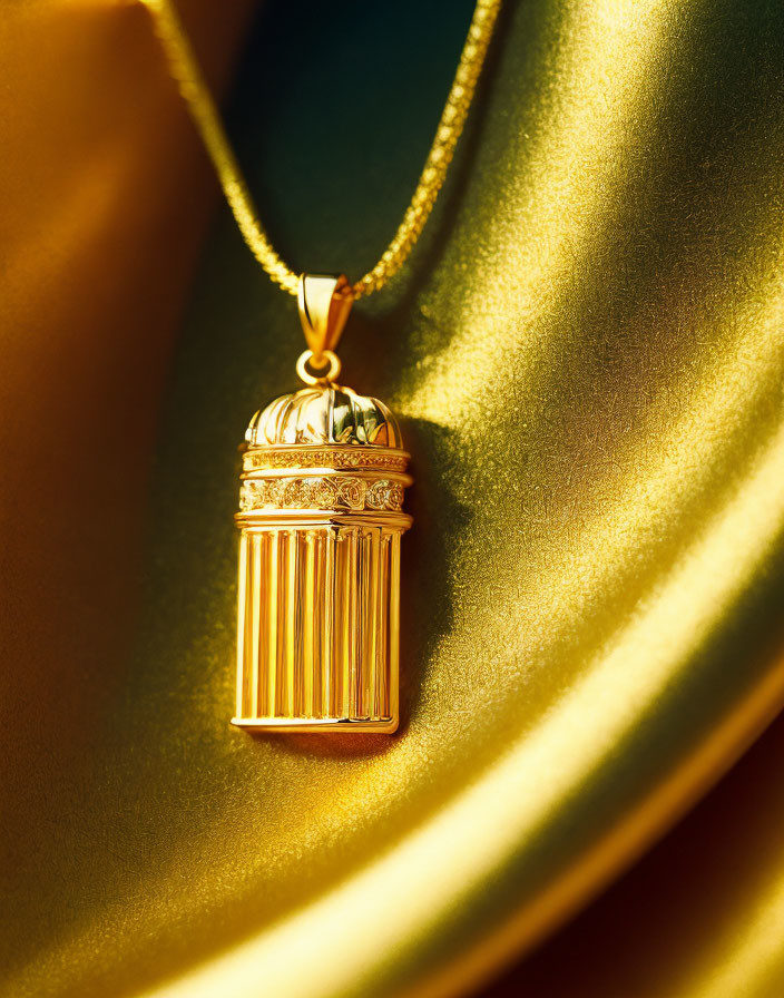 Gold Birdcage Pendant Necklace on Satiny Golden Background