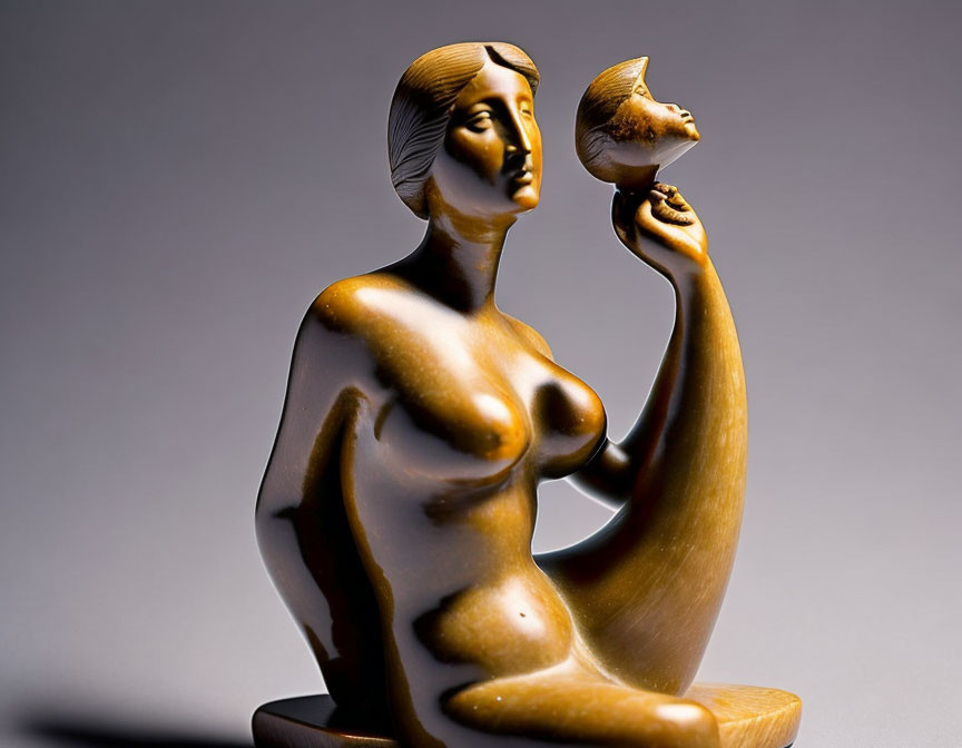 Bronze seated woman sculpture with bird in hand, art deco style