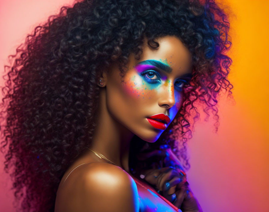 Colorful background frames woman with vibrant makeup and curly hair