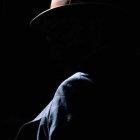 Silhouette of a Person in Fedora Hat with Highlighted Features