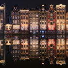 Colorful, ornate buildings in starry night reflection with crescent moon