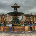 Ornate Fountain in Cobblestone Square with European Buildings