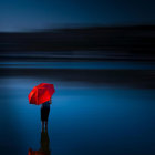 Person with red umbrella and balloon by calm water under dark blue sky