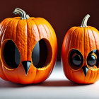 Cartoon-style pumpkins with expressive eyes on warm autumn background