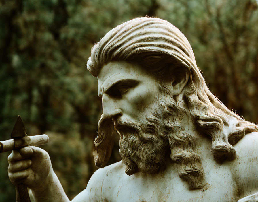 Classical sculpture close-up: Bearded man with spear, wavy hair