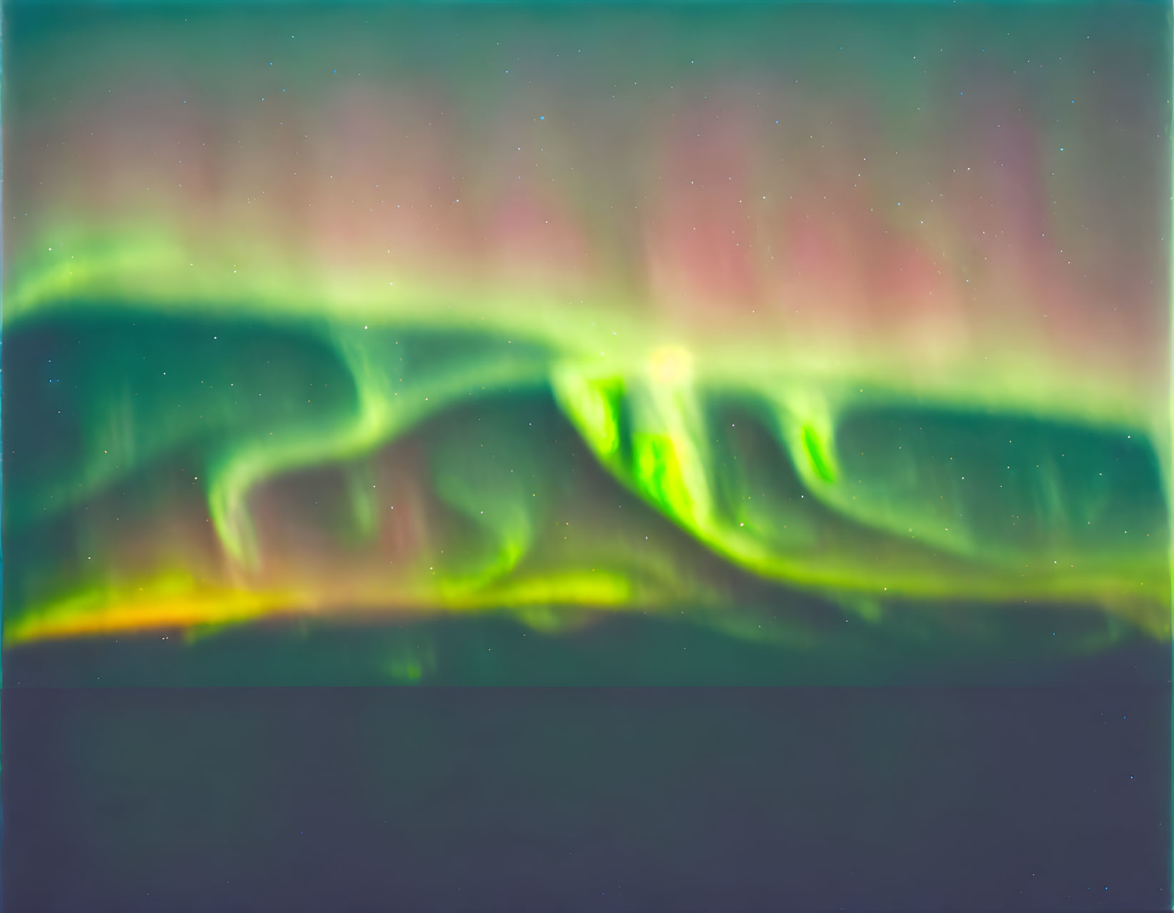 Blurred image of Northern Lights in green and pink spectrum