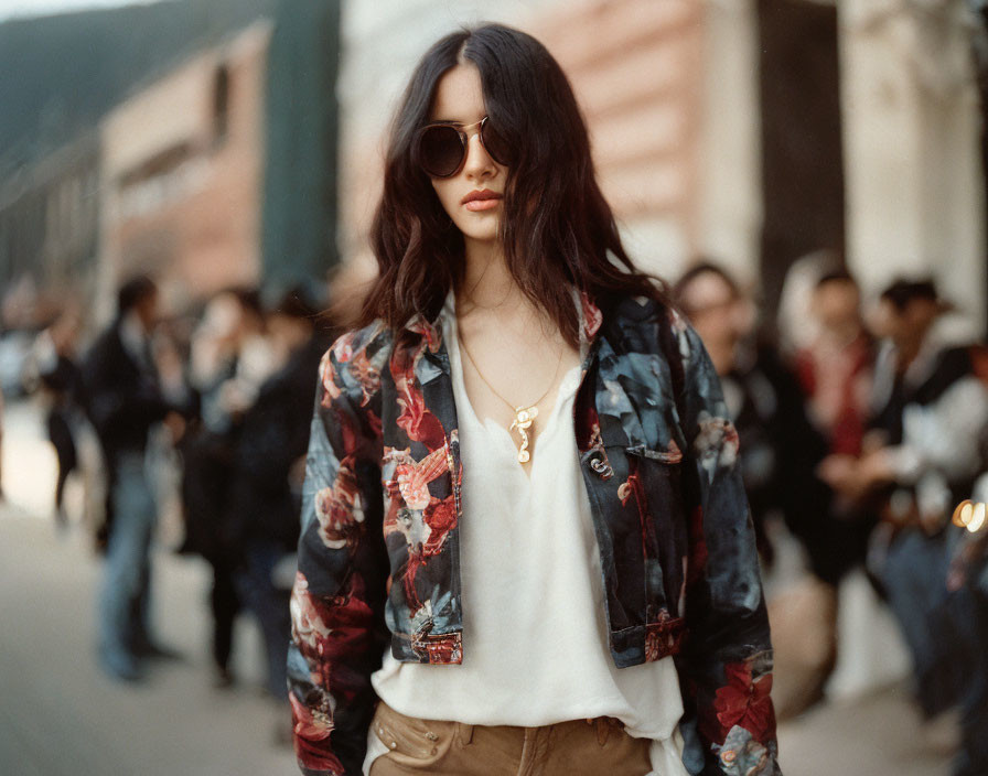 Confident woman in floral jacket on city street