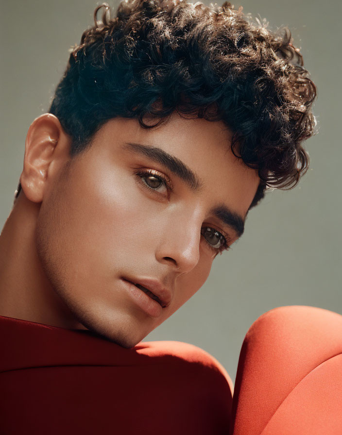 Curly Hair Person Portrait with Styled Makeup and Red Top