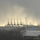 Stormy Seascape with Lightning Striking Futuristic Buildings