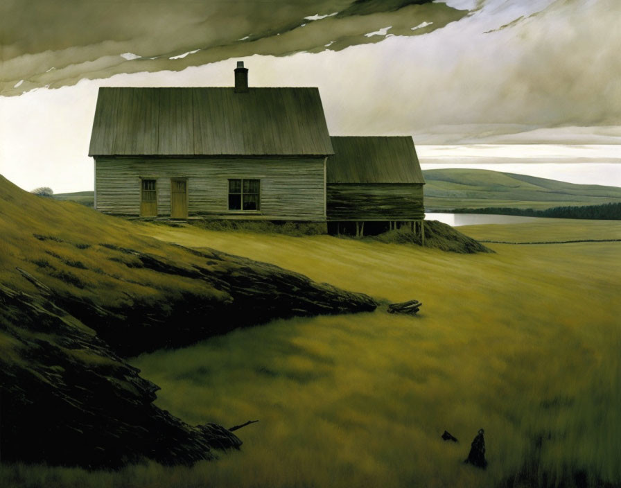 Rural landscape with old wooden house on grassy hill under dramatic sky