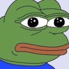 Pepe the Frog Meme Character in Blue Shirt with Sad Expression