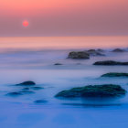 Tranquil sunset seascape with soft waves and blue-pink hues