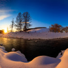 Snow-covered peninsula with river in winter landscape.