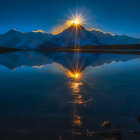 Snowy Mountain Peaks Reflecting Serene Sunset in Calm Lake