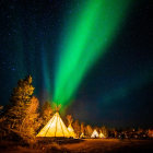 Night-time forest scene with two people near glowing tents under green aurora borealis