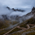 Majestic mountain landscape with winding river and mist-covered valley