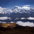 Misty Mountain Ranges Over Golden Hills and Settlement