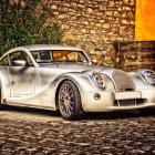 Sleek Silver Futuristic Sports Car on Autumn Road