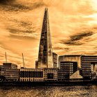 Futuristic cityscape with towering spire and dome-shaped buildings under amber sky