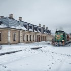 Modern curved architecture in snowy landscape with large glass windows